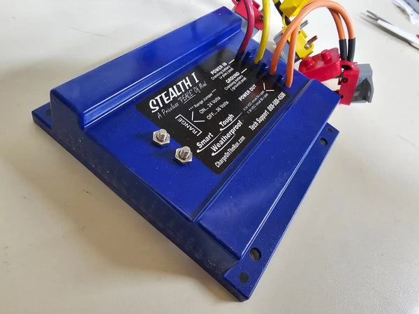 Blue electronic control module with multiple wire connections and ’STEALTH’ branding.