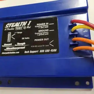 Blue electronic control box with power connections and orange wire clips.