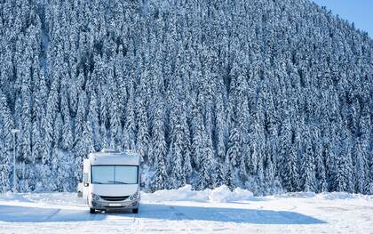 rv in snowy forest